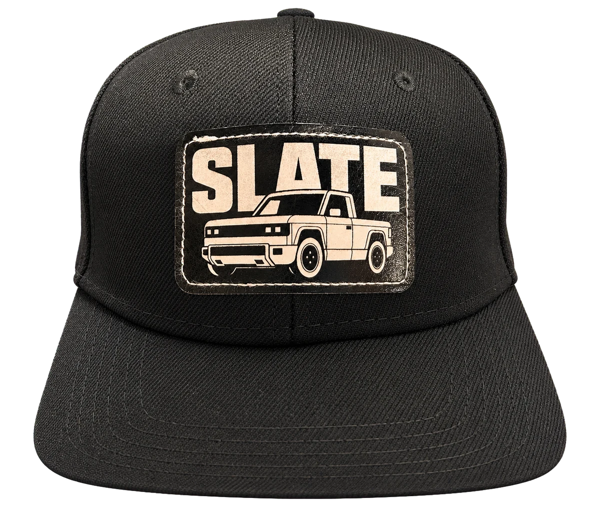 Black baseball cap with a cream pickup truck patch