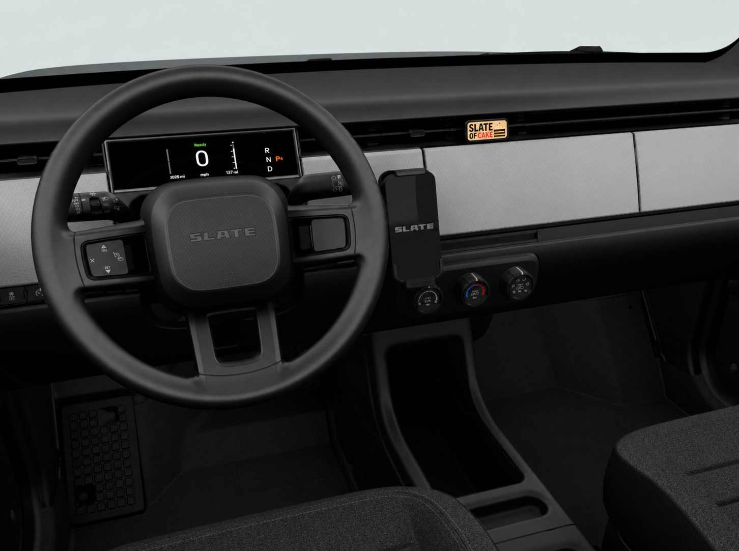 Wide view of a Slate pickup interior with a RadPaul Dash Badge installed in the dashboard vent