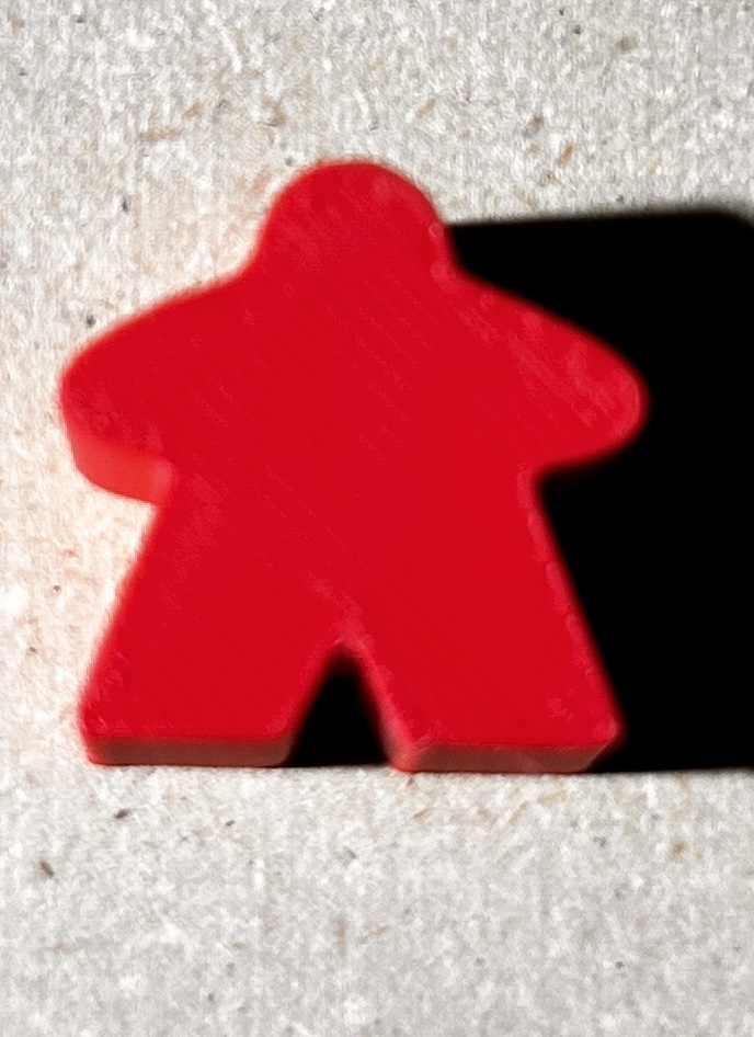Red 3D-printed meeple included free with a custom TinForge insert for a limited time