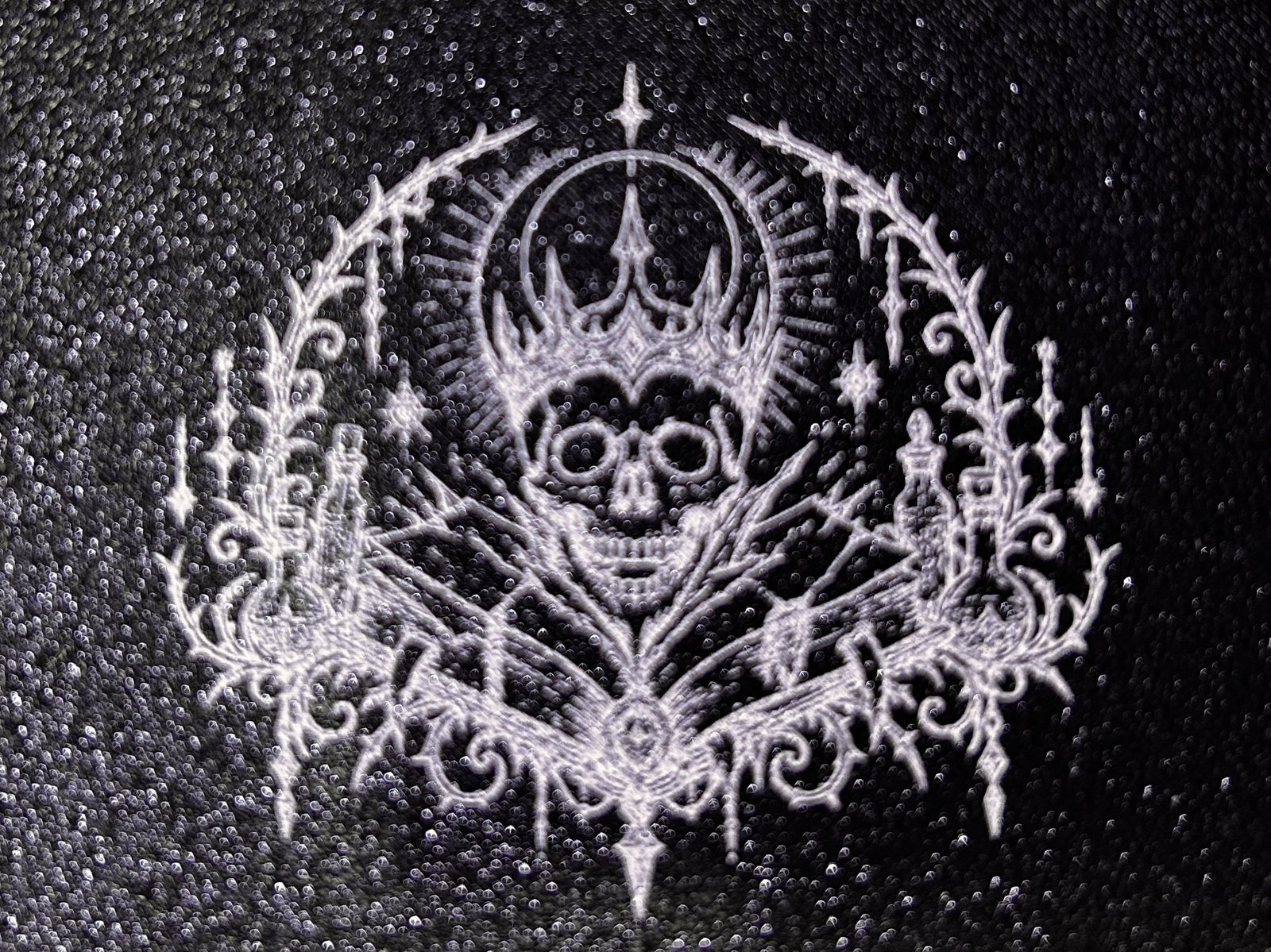 Skull laser graphic on black printed plastic