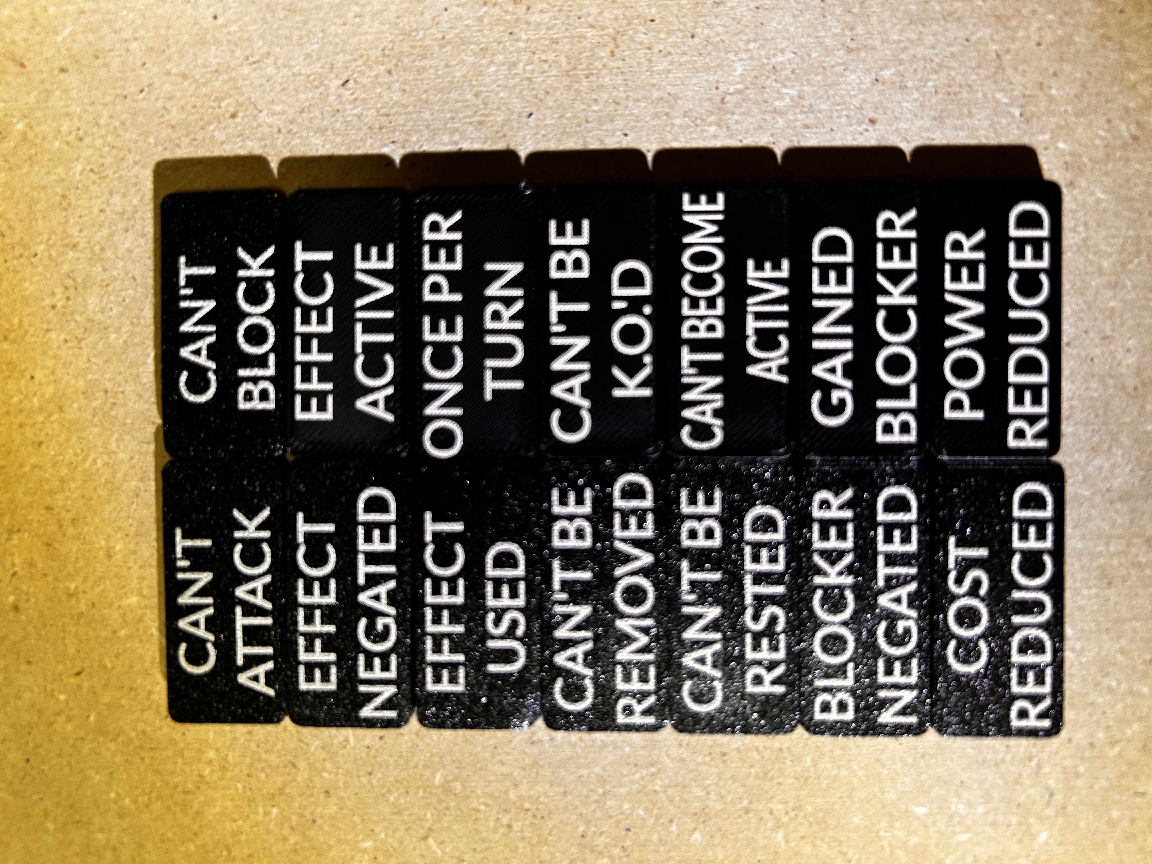 All seven Slim Tokens arranged in two rows, with front sides on the left and back sides on the right